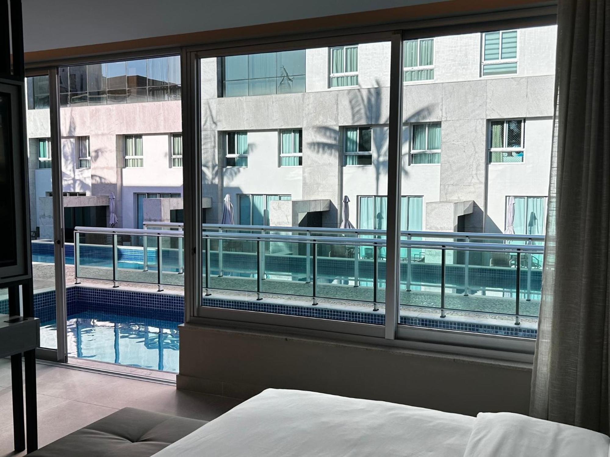 Jade Hotel Brasilia Candangolandia Bagian luar foto A view of the pool from a guest room